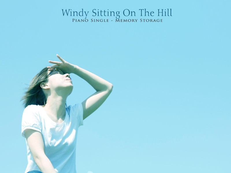 Sitting On A Hill Blowing The Wind (Single)